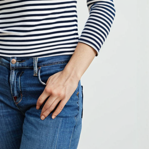 Home 15 **
Prompt: "A woman wearing a Breton striped top with blue jeans. Classic, minimalist style. Clean background, natural light."
**